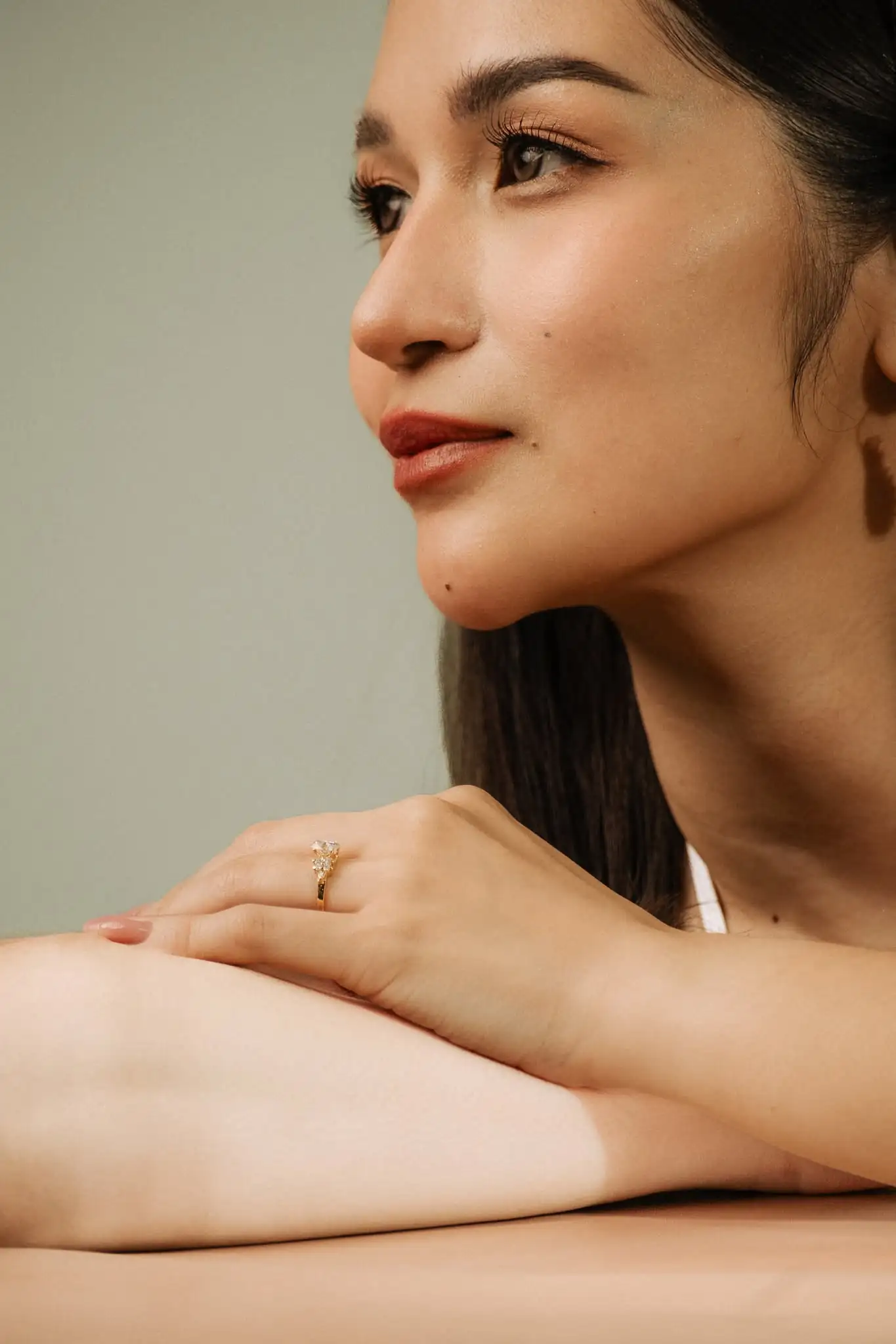 A woman wearing a Love, Belle ring