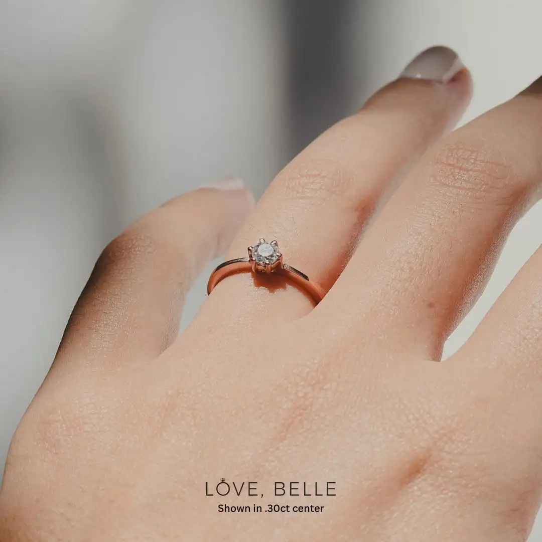 A Love, Belle yellow gold solitaire worn on the hand